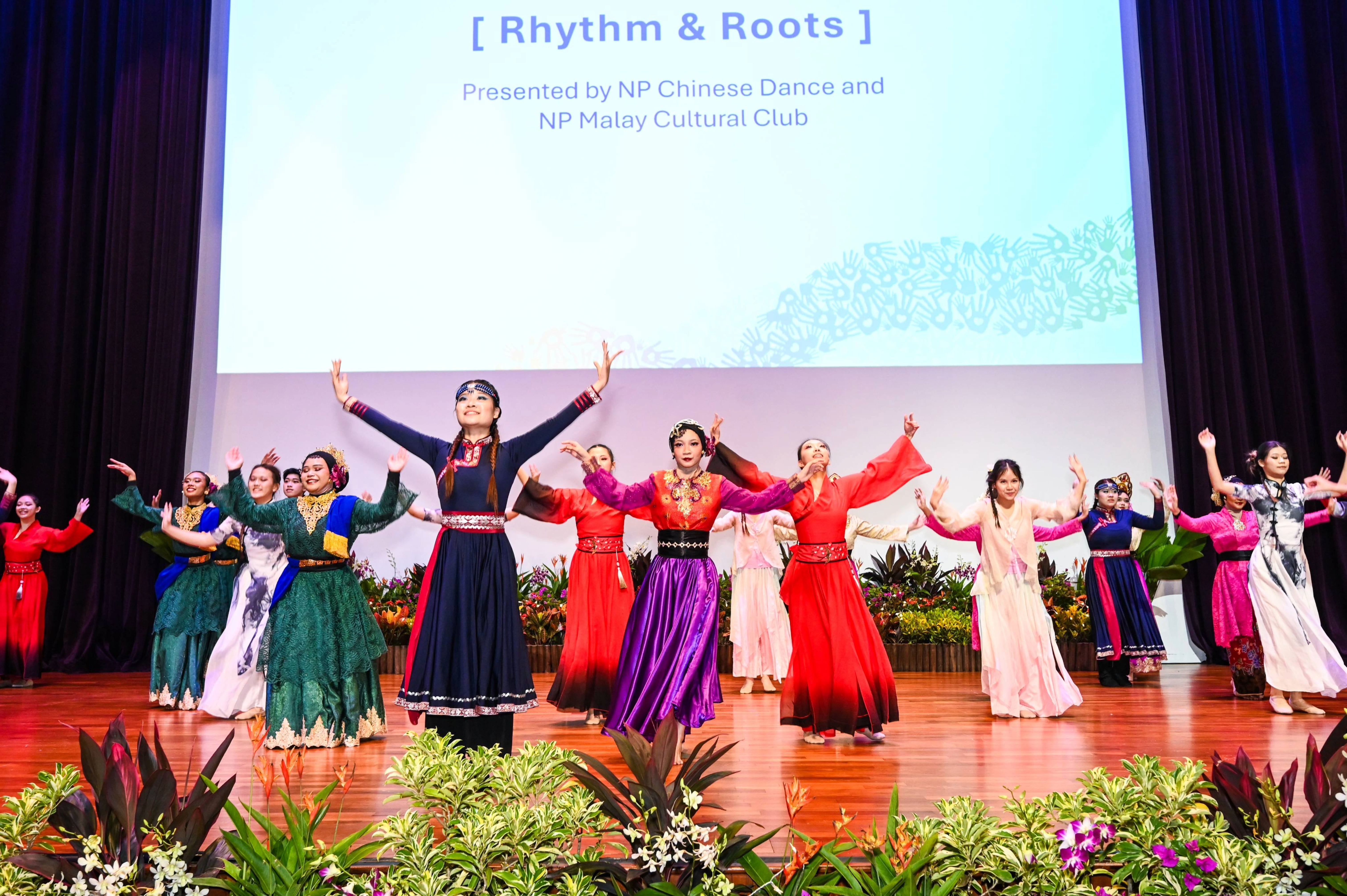 NP Chinese Dance and NP Malay Cultural Club presenting Rhythm & Roots, a vibrant cultural performance celebrating diversity through dance.